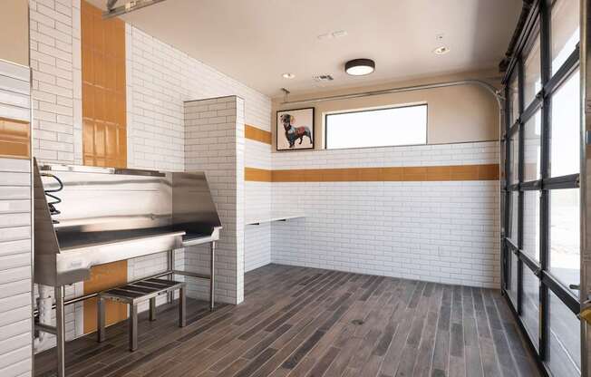 A kitchen with a grill and a window.