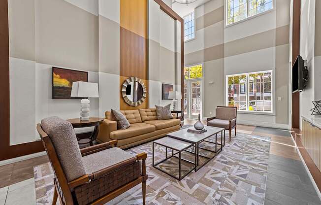 a living room with couches and chairs and a table
