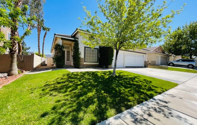Single-story 4 Bed nestled in the desirable Green Valley Ranch!  3 Car Garage!