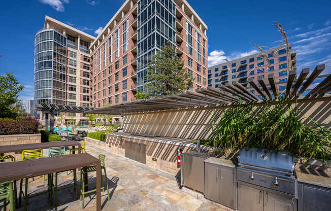 A patio with a table and chairs is in front of a building.