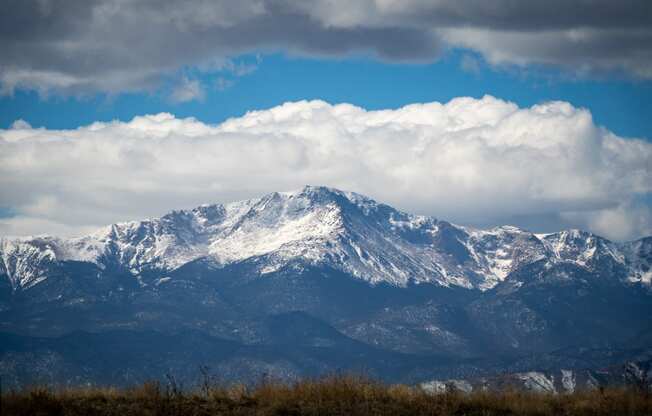 a view of the mountains with clouds in the sky