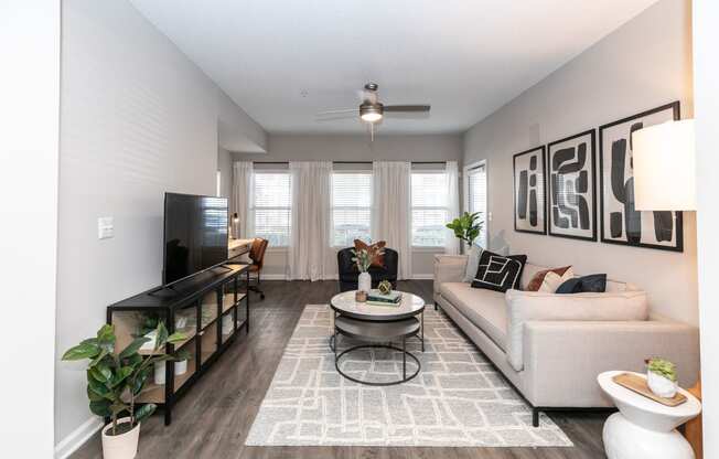 an open living room with a couch and a table at Willowest in Lindbergh, Georgia, 30318