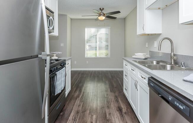 a kitchen with a sink and a window