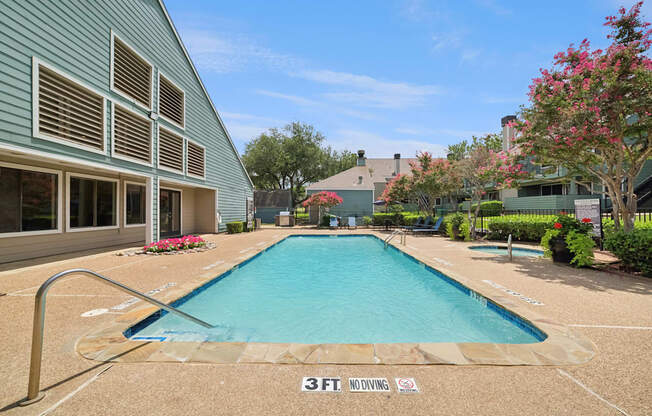 A pool with the text 3FT. NO DIVING on the ground.