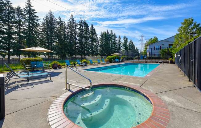 Community Swimming Pool and Hot Tub at Landings at Morrison Apartments located in Gresham, OR.
