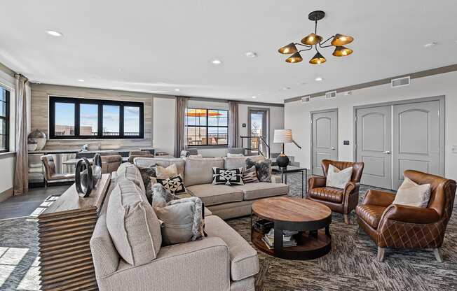 a living room with couches and chairs and a kitchen at Alton Jefferson Park, Colorado