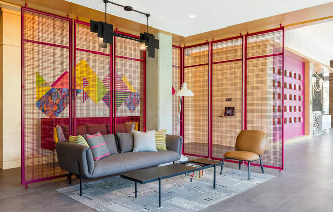 a living room with a couch and a coffee table in a lobby