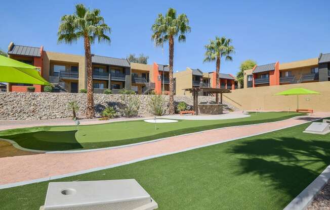 Putting green and cornhole for residents of Onnix Apartments