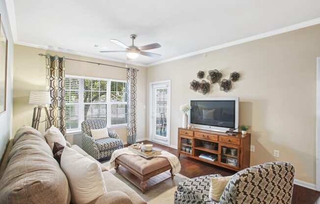 a living room with a couch and a tv