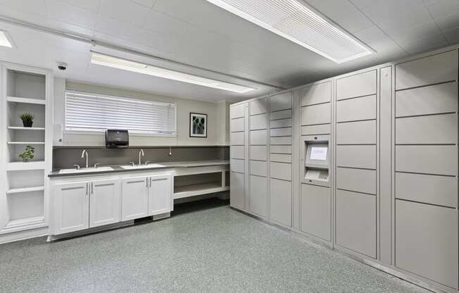 a large room with a Double sink and Package Receiving Lockers at Charbern Apartment Homes, Seattle
