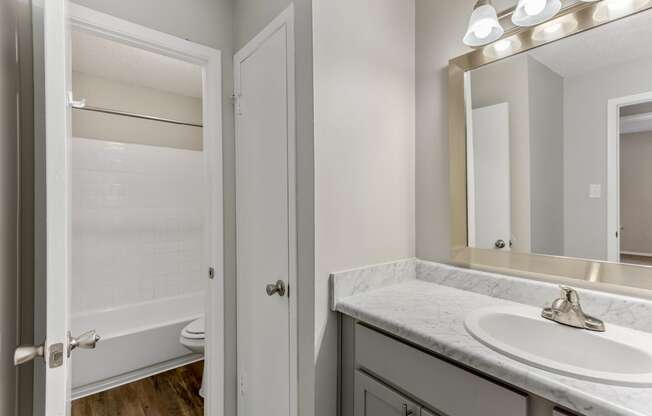 a bathroom with a toilet and a sink