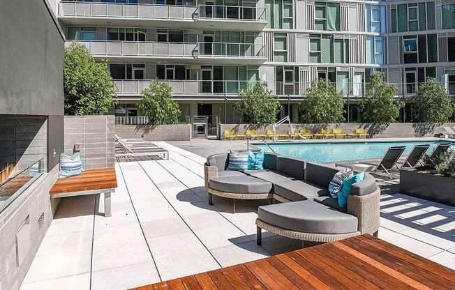 sunlit modern lounges by pool at K1 Apartments, San Diego, CA