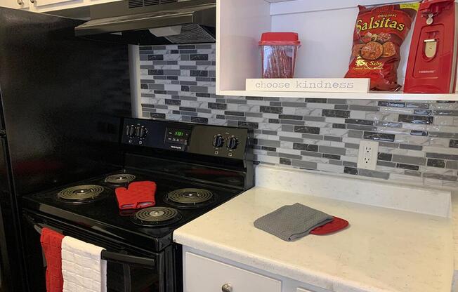 a stove top oven sitting inside of a kitchen counter