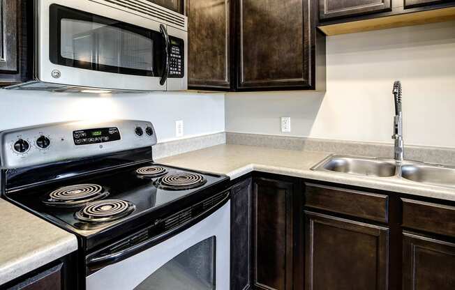 Kitchen with dark cabinets at Tamarin Ridge in Lincoln, NE