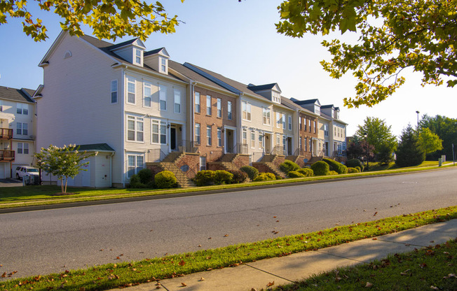 a row of houses on the side of a street