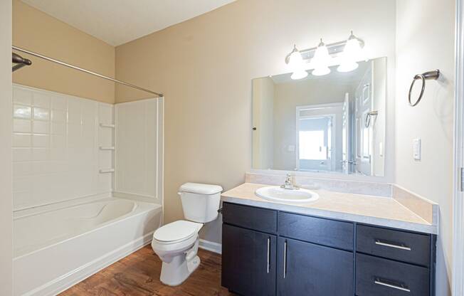 a bathroom with a sink toilet and a shower