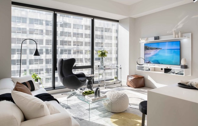 a living room filled with furniture and a large window at 220 Meridian, Indianapolis, IN 46204