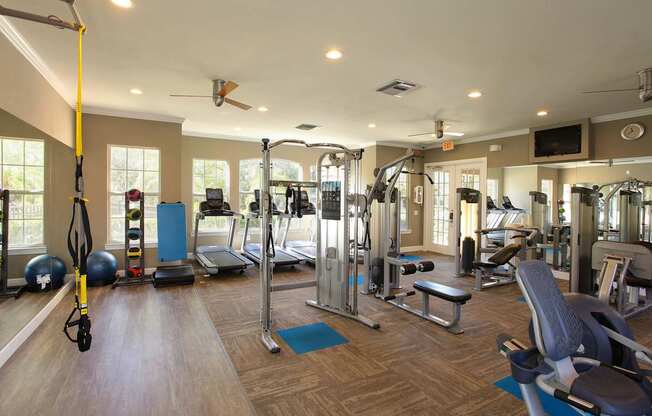 Fitness center with cardio and weight machines, TRX bands and free weights