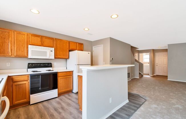 3BR Townhome Near DIA & Light Rail | New Carpet, Garage & Fenced Patio