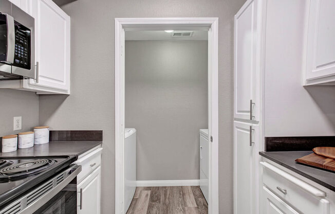 a kitchen with a stove and a microwave