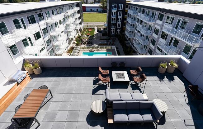 Our 5th floor outdoor deck features lounge seating and a cozy fire table, perfect for evening hangouts or sunset views.