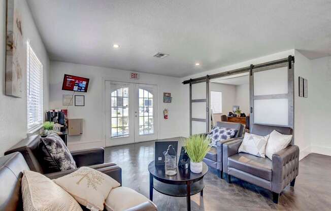 A living room with a grey couch and a coffee table.