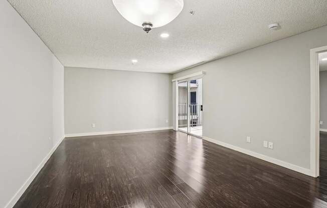 A room with a wooden floor and a white ceiling.