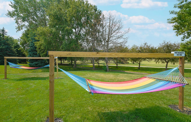 two rainbow striped hammocks outside the clubhouse at Williamsburg Park apartments in Lincoln
