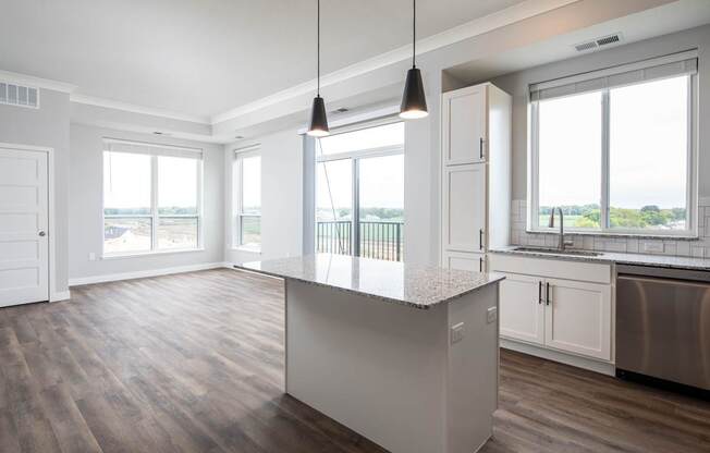 A kitchen with a large island in the middle.