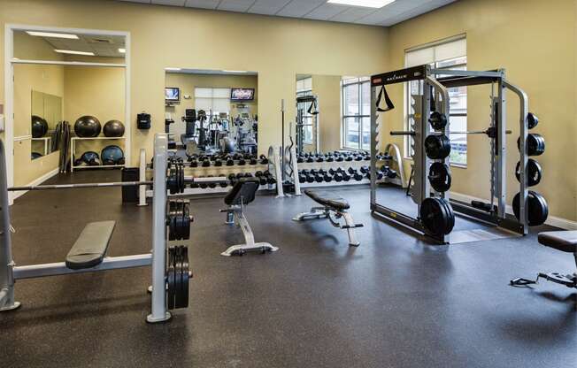 harrison park apartments fitness center with weight lifting e