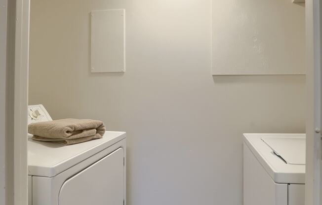 Mechanicsburg Apartments | Delbrook Manor Apartments | a small laundry room with a washer and dryer