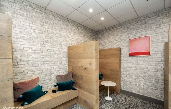 a room with a bunk bed and a small table