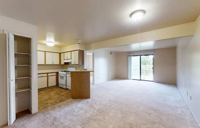 Two bedroom one bath living room and kitchen at Canal Club Apartments, Michigan, 48917