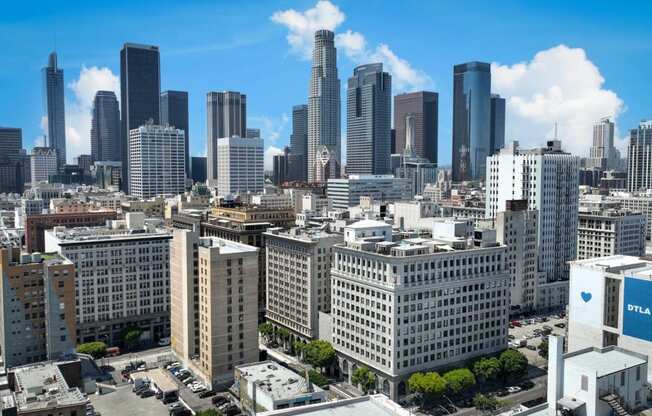 an aerial view of a city with tall buildings and skyscrapers