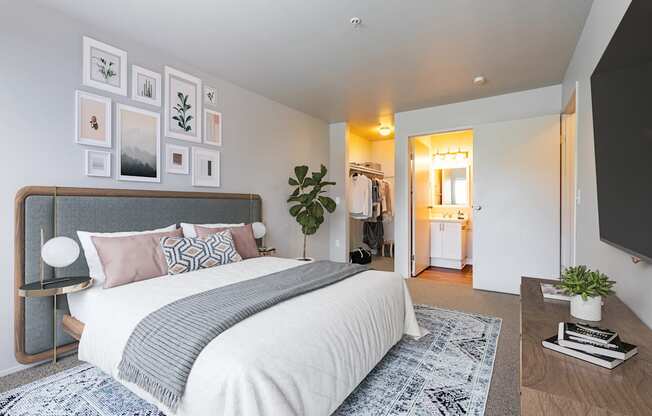 a bedroom with a bed and a tv