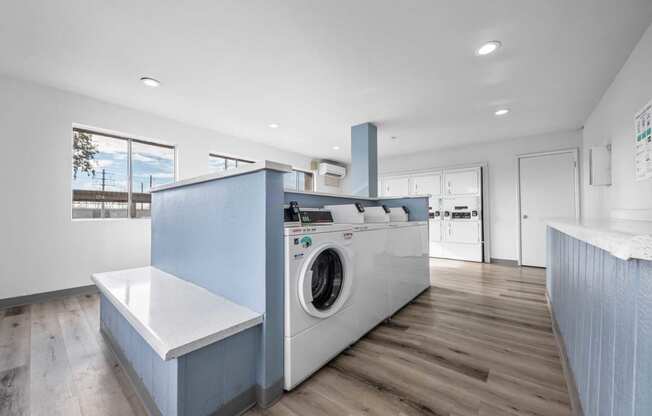 a kitchen with a washing machine in it