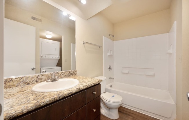 Fountains Of Fair Oaks bathroom with sink toilet and tub