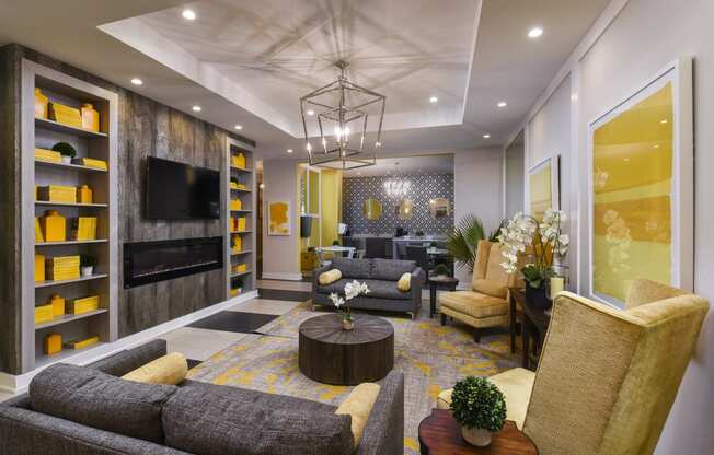 a living room with couches and chairs and a television