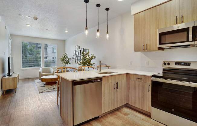 A modern kitchen with wooden cabinets and a large island.