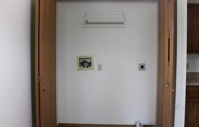 an open door with a cat curled up on the floor in front of it