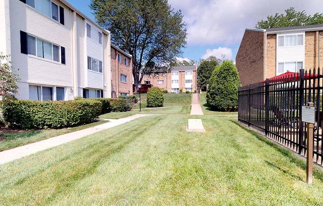 Green grass area with cornhole area at Tysons Glen Apartments and Townhomes, Falls Church, Virginia