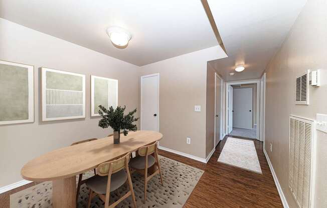 A room with a table and chairs in it.