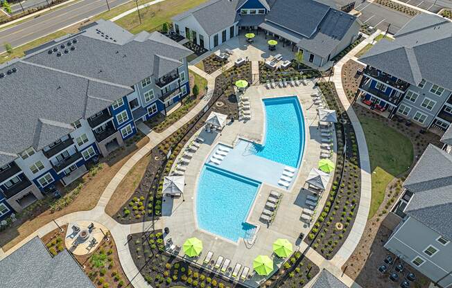 an overhead view of a swimming pool in an apartment complex