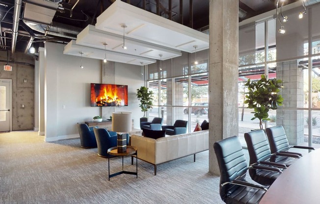 a room with a fireplace and a table and chairs