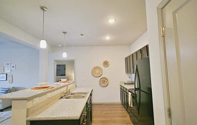 a kitchen with stainless steel appliances and granite counter tops