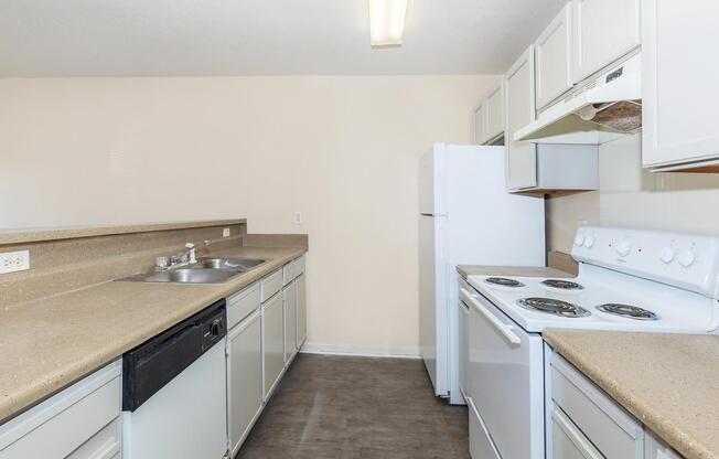 a kitchen with a stove and a sink