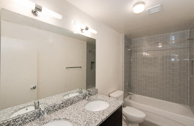 a bathroom with a sink toilet and bathtub