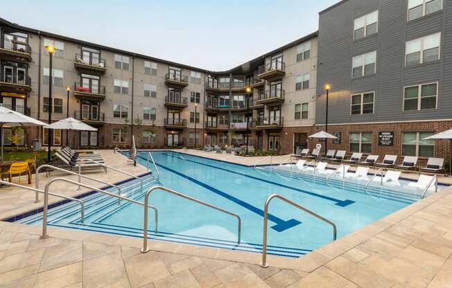 a swimming pool in the middle of an apartment building