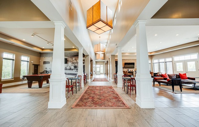 the preserve at cardinal courts spacious lobby with piano and tables