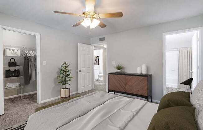 A bedroom with a bed, a dresser, and a mirror.